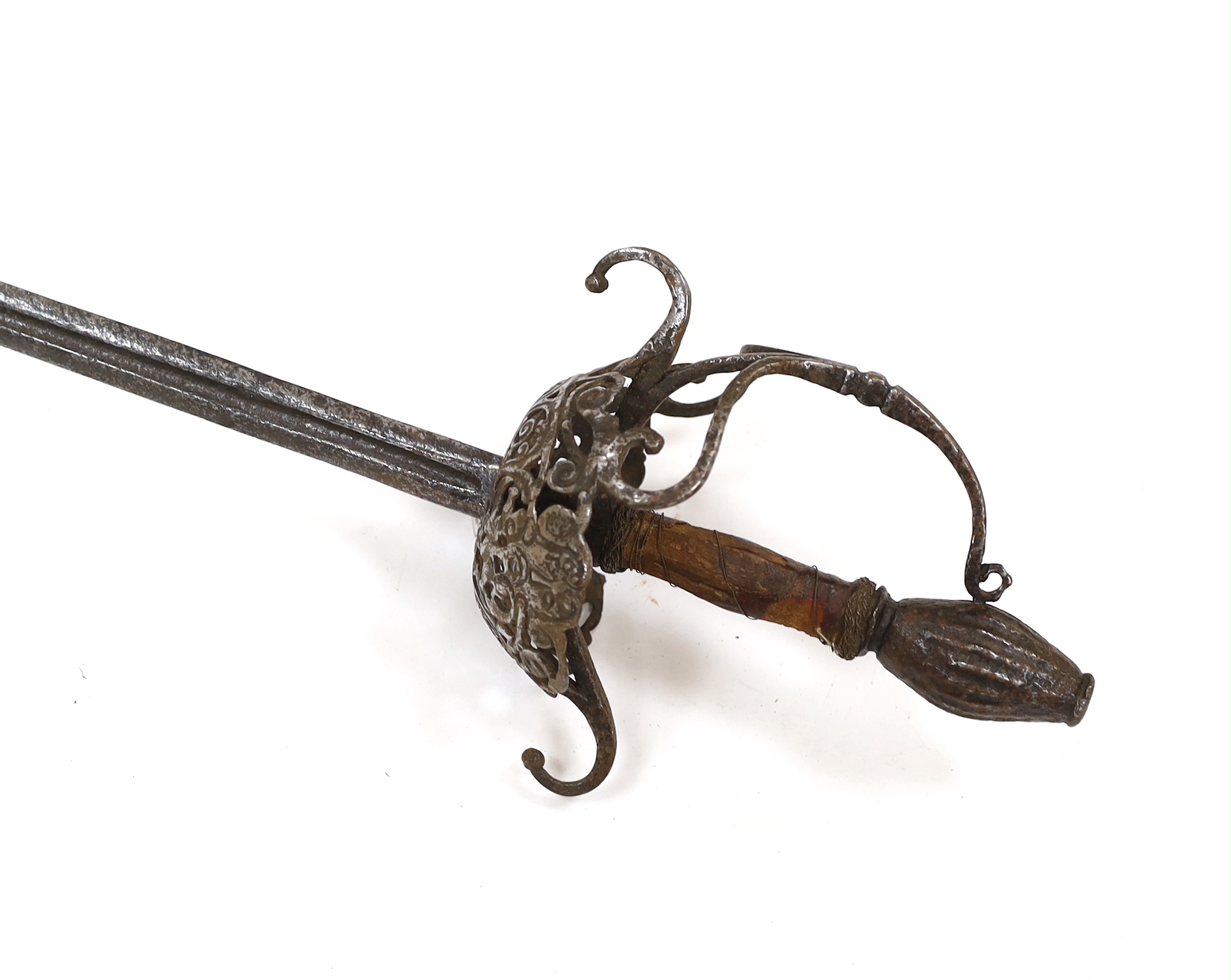 A mid 17th century English rapier, with pierced and chiselled cup guard, steel pommel and leather grip, blade 81cm